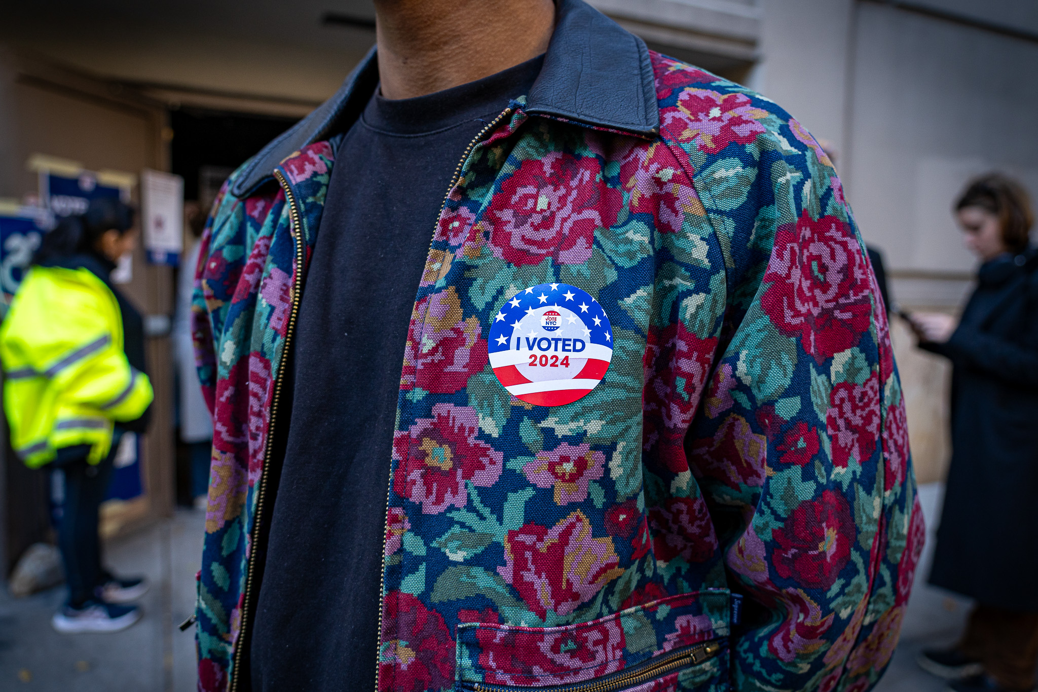 Young voter proudly wears voting stickers